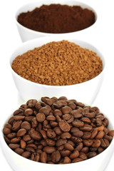 Different types of coffee in three cups isolated on white