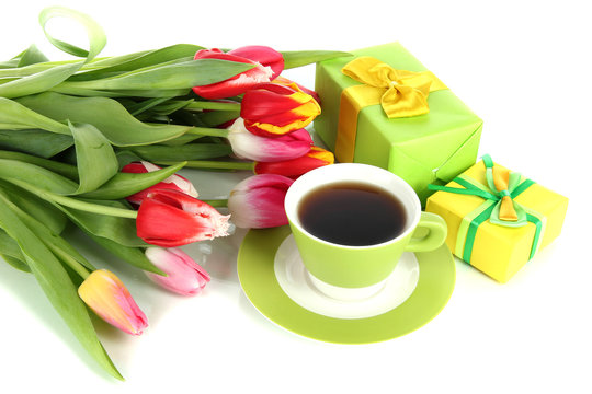 Beautiful tulips in bucket with gifts and cup of tea isolated