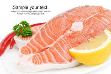 Salmon steak with lemon, pepper and parsley