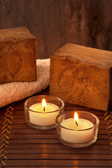 SPA atmosphere with two candles with light and soap