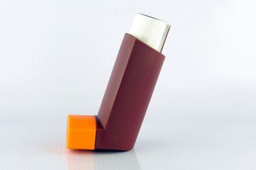 Asthma inhaler on white background