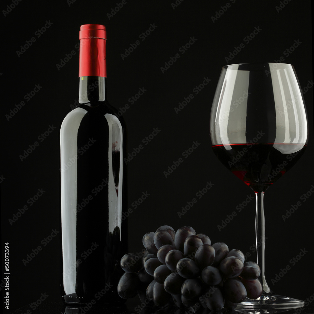 Wall mural bottle with red wine and glass and grapes