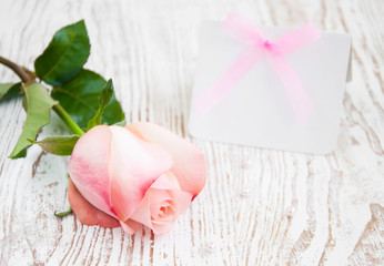 Blank card for your message and pink rose
