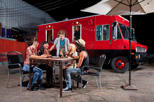 Eating Pizza Near Food Truck