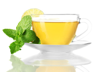 Cup of tea with mint and lime isolated on white