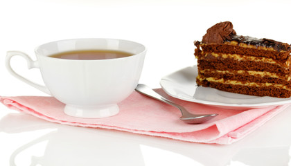 A cup of tea and delicious cake isolated on white