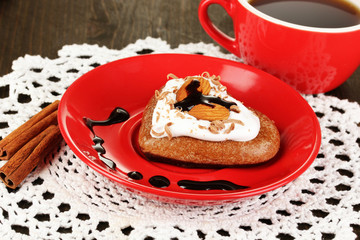 Chocolate cookie in form of heart with cup of coffee