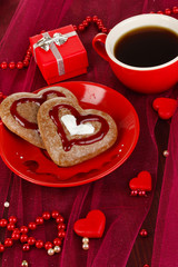 Chocolate cookies in form of heart with cup of coffee
