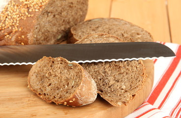 Sliced bread with sesame seeds and knife