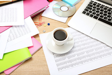 Cup of coffee on office desktop close-up