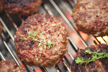 food meat - beef burgers on bbq  barbecue grill with flame - 50081967