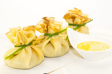 pancakes with meat on a table in a restaurant