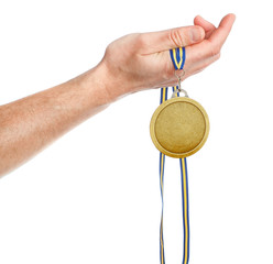 Naklejka na ściany i meble Gold medal winner in the hand. On a white background.