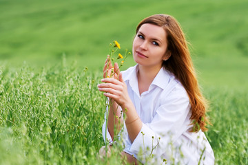 Happy young woman in a field
