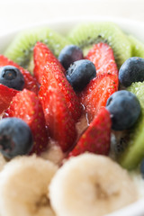 yogurt with banana, kiwi and berries