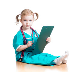 Child girl uniformed as doctor writing to clipboard isolated on