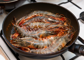 Giant prawns being fried on pan