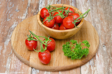 cherry tomatoes in wooden bowl