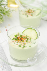cold soup with avocado, cucumber and yogurt in a glass beaker