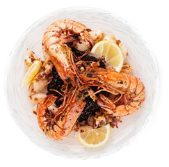 Jumbo prawns and grilled squids with rice isolated on white