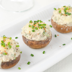 Stuffed mushrooms, baked with cheese and herbs, selective focus