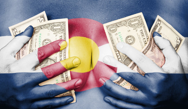 Sweaty girl covered her breast with money, flag of Colorado