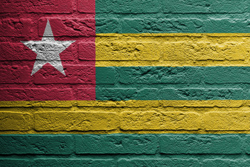 Brick wall with a painting of a flag, Togo