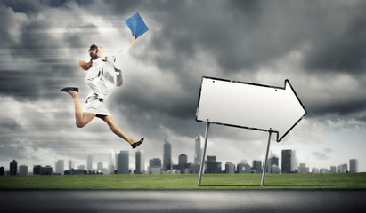 Businesswoman running on the road