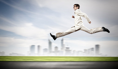 Businessman running on the road