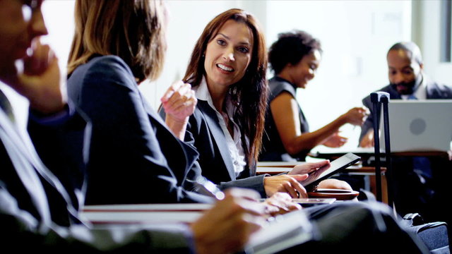 Female business colleagues meeting airport lounge