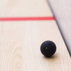 Squash ball with yellow dot