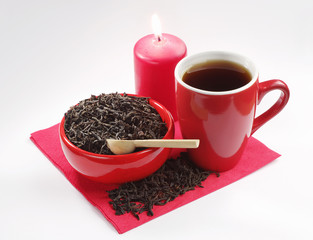 Red ceramic dishes with black tea