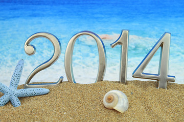 Fototapeta na wymiar Nowy rok 2014 na plaży