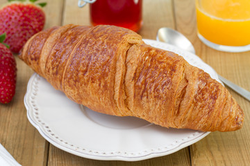 croissant with jam and juice