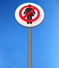 'NO WOMEN' ISOLATED AGAINST A BRIGHT BLUE SKY