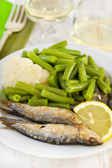 fried sardines with beans and lemon