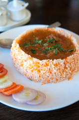 traditional Indian meal with biryani and curry