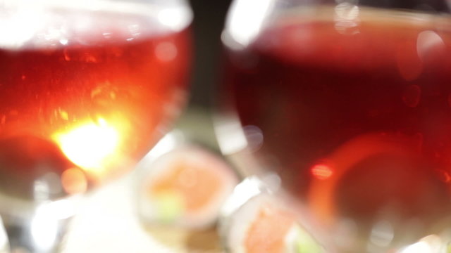 Sushi rolls and plum wine. Beautiful shallow dof.