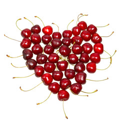 Obraz na płótnie Canvas Heart from a sweet cherry on white background