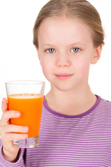 Young girl drinking orange juice