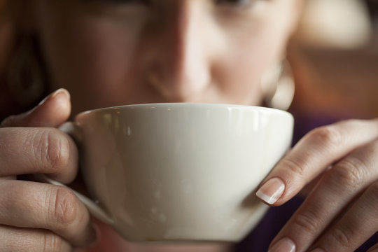 Woman Holding Her Morning Cup of Coffee