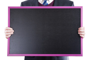Business man holding black empty chalkboard