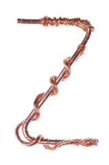 Twisted copper wire in the shape of the letter Z