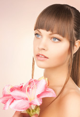 Fototapeta premium lovely woman with red lily flower