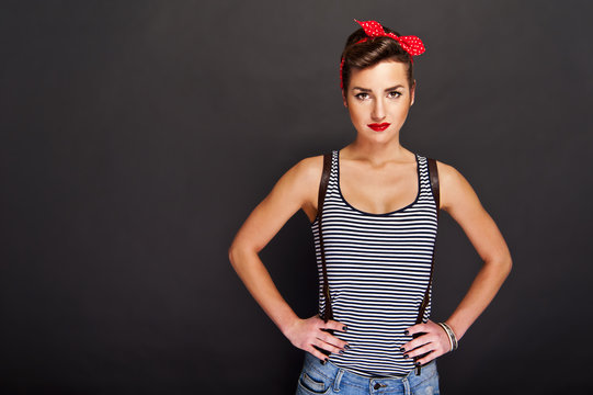 Pin-up woman with smile on black background