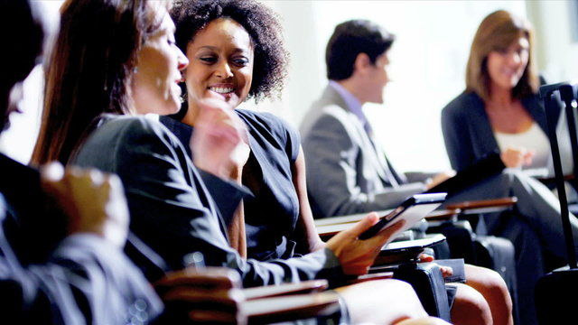 Business executives meeting in airport lounge