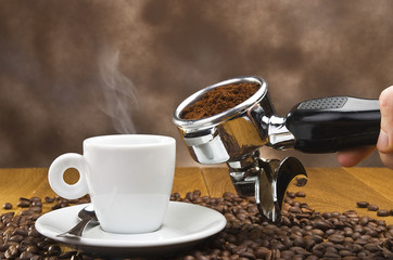 An espresso machine group head with fresh ground coffee