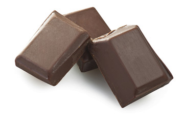 close up of chocolate pieces on white background
