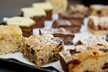 a tray of homemade baked goods, featuring fruit slice