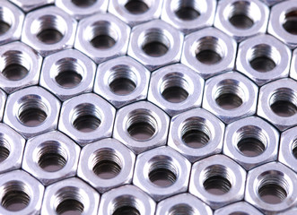 Nuts of bolts as a background